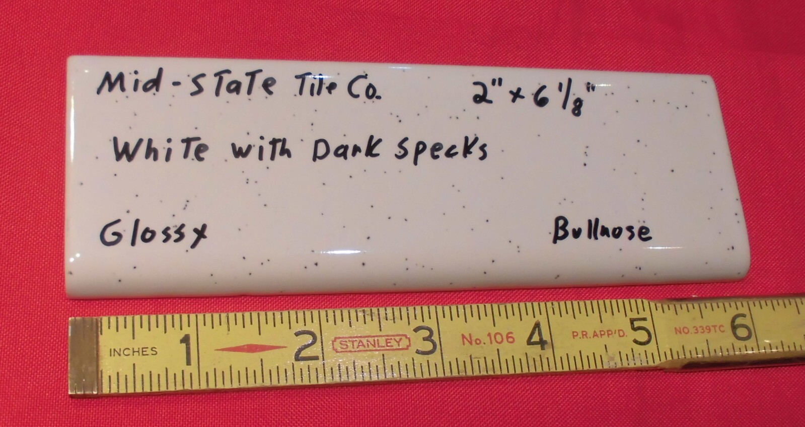 1 pc. White + Dark Specks: 2” X 6” Surface Bullnose Ceramic Tile by MID-STATE