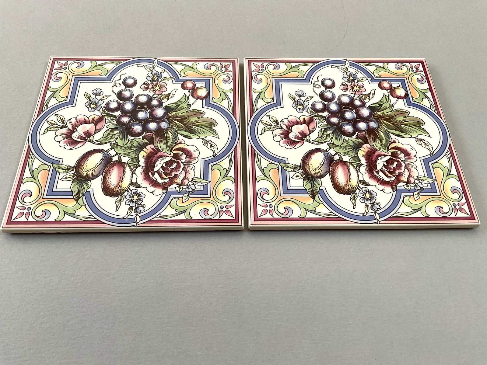 A Pair of Ceramic Tiles/Trivets with Floral and Fruit Pattern 5 7/8″ x 5 7/8″