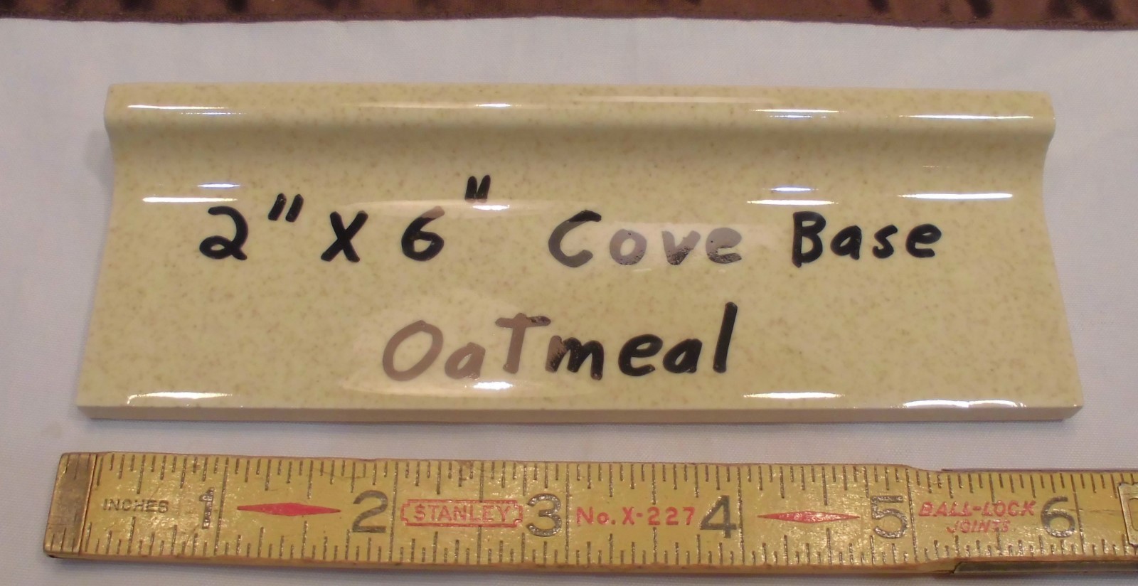 1 pc. Oatmeal – Yellow Speckled; stack-on-top base/cove Ceramic Tile 2″ X 6″