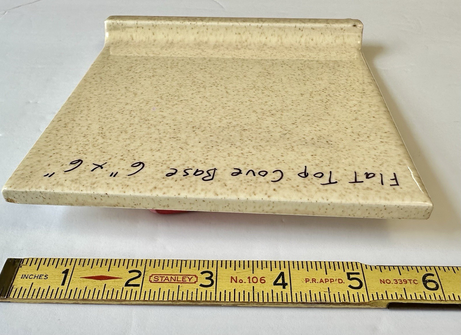 1 pc. Oatmeal Speckled Color: 6” X 6” Glossy Ceramic Cove Base Tile