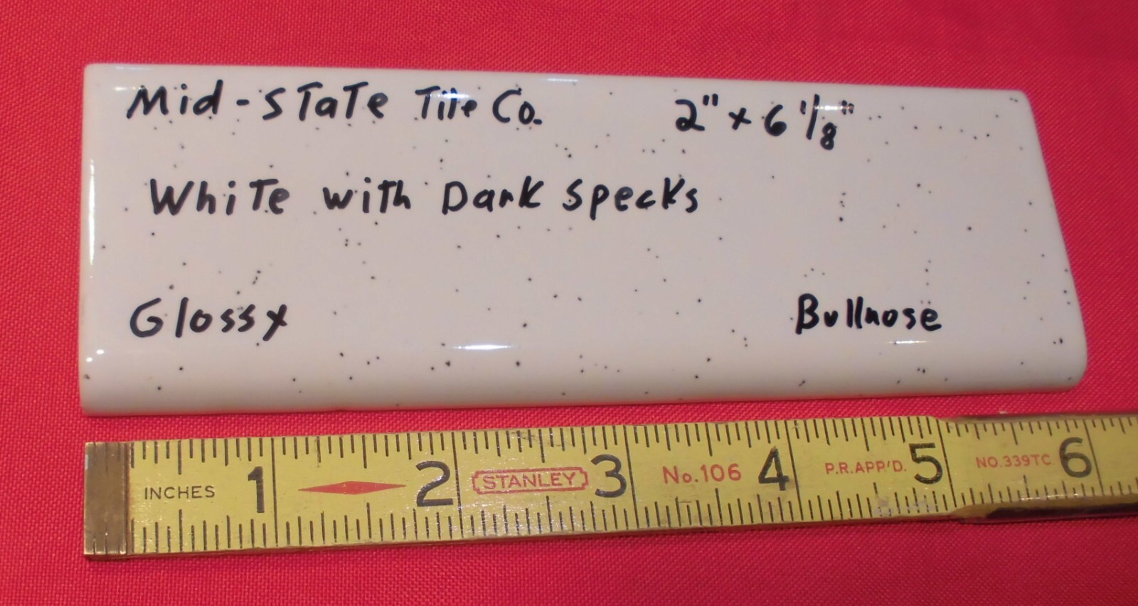 1 pc. White + Dark Specks: 2” X 6” Surface Bullnose Ceramic Tile by MID-STATE