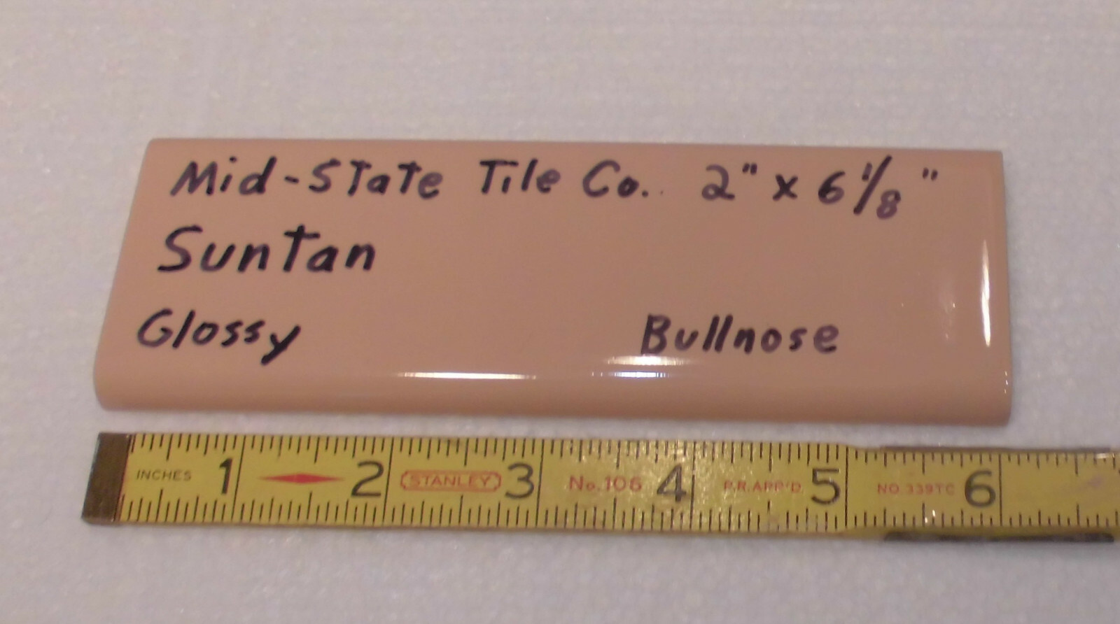 1 pc. Suntan-Beige 2” X 6” Glossy Ceramic Surface Bullnose tile by Mid-State Co.