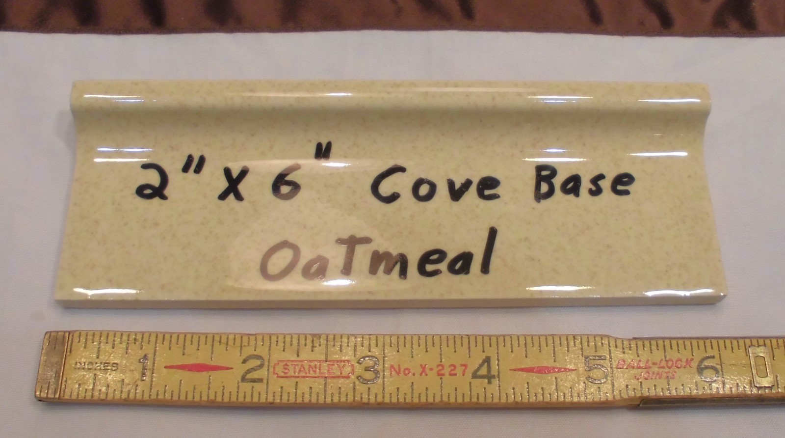 1 pc. Oatmeal – Yellow Speckled; stack-on-top base/cove Ceramic Tile 2″ X 6″
