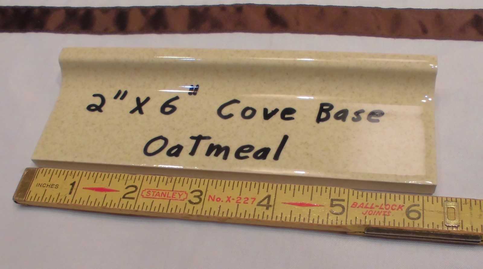 1 pc. Oatmeal – Yellow Speckled; stack-on-top base/cove Ceramic Tile 2″ X 6″