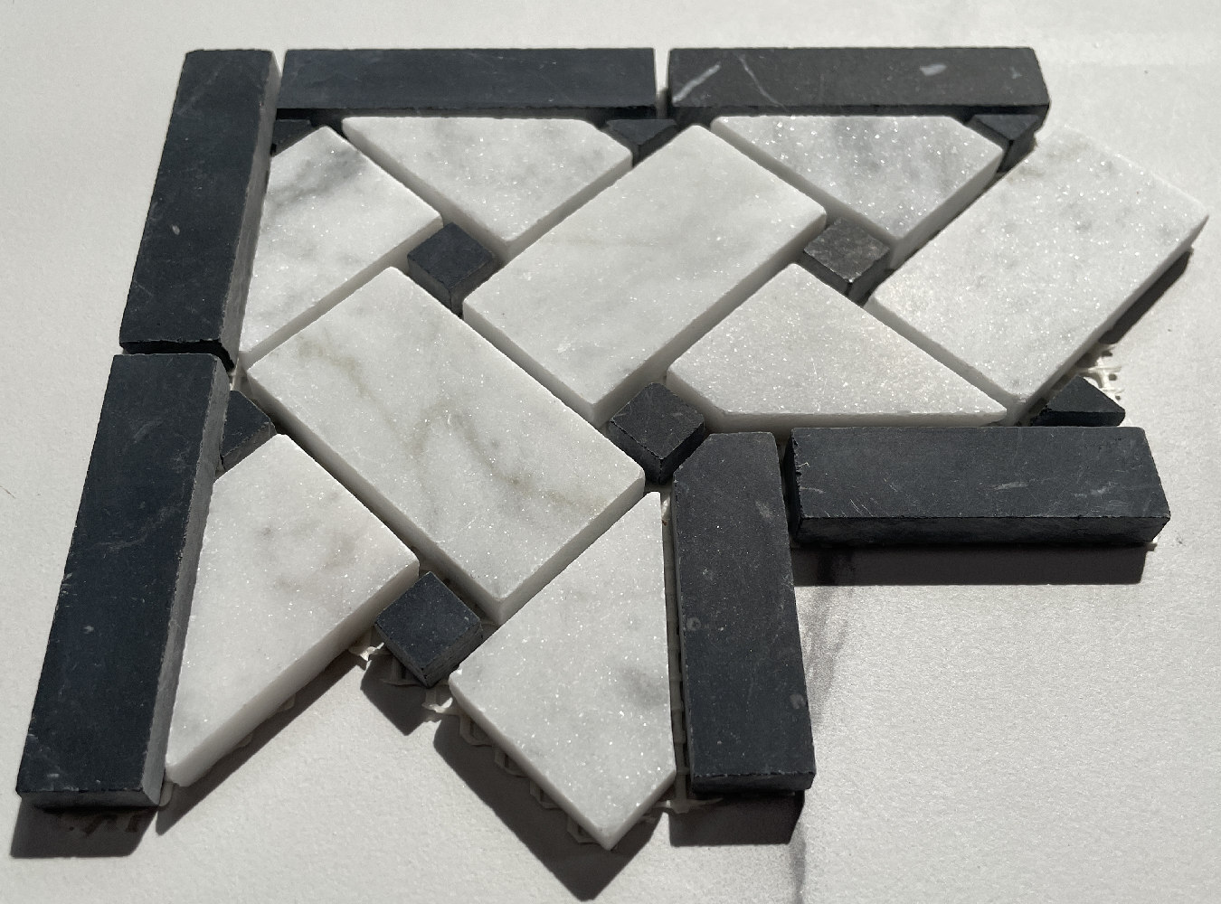C651CXH Carrara Venato Carrera Marble 4×4 Basketweave Mosaic Corner Honed