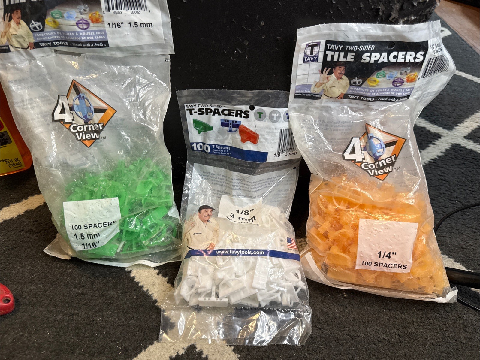 3 BAGS OF TILE SPACERS OF 1/4” & 1/8” & 1/16” Inch, 2 BAGS ARE OPEN & 1 SEALED