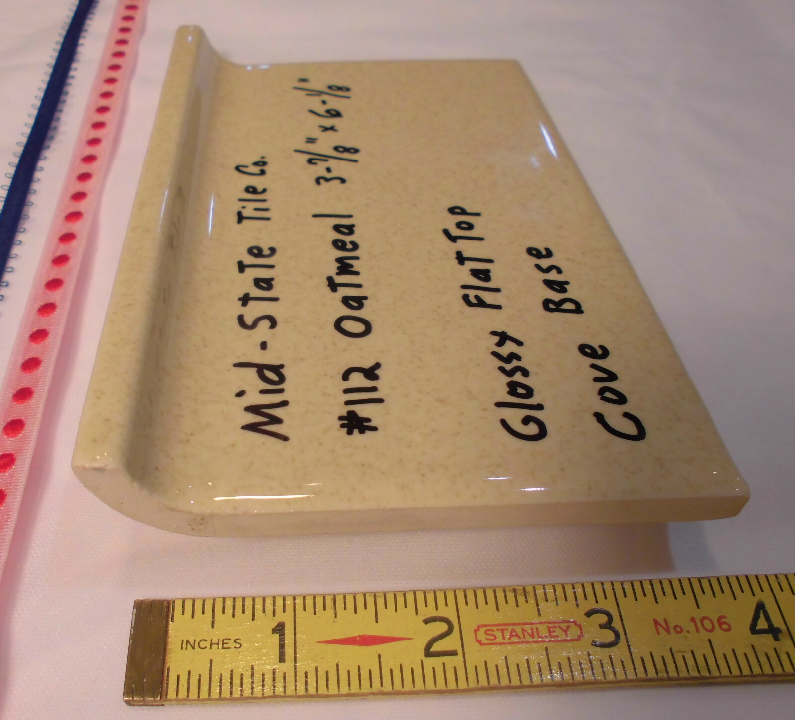 1 pc. Glossy *Oatmeal* 4” X 6” Ceramic Cove Base Tile by Mid-State, flat top