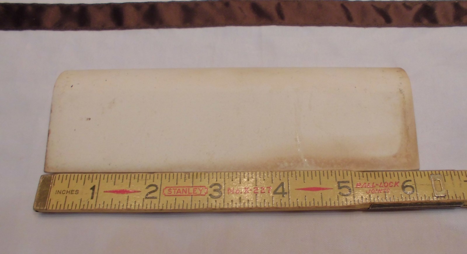 1 pc. Oatmeal – Yellow Speckled; stack-on-top base/cove Ceramic Tile 2″ X 6″