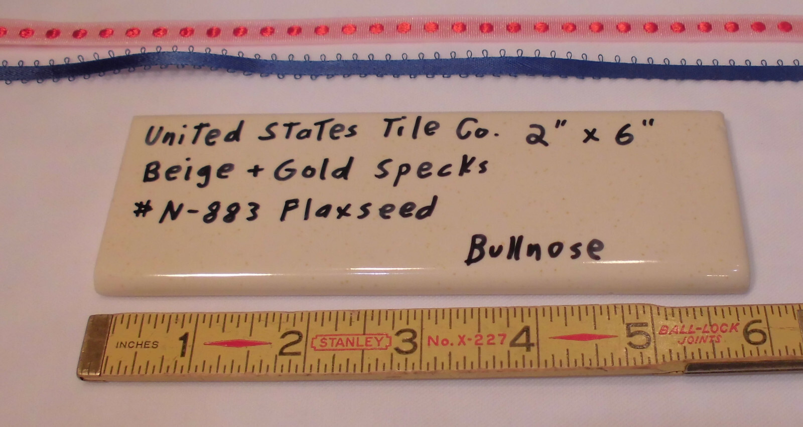 1 pc. Flaxseed / Beige + Gold Specks; Glossy Bullnose Surface Flat Ceramic Tile