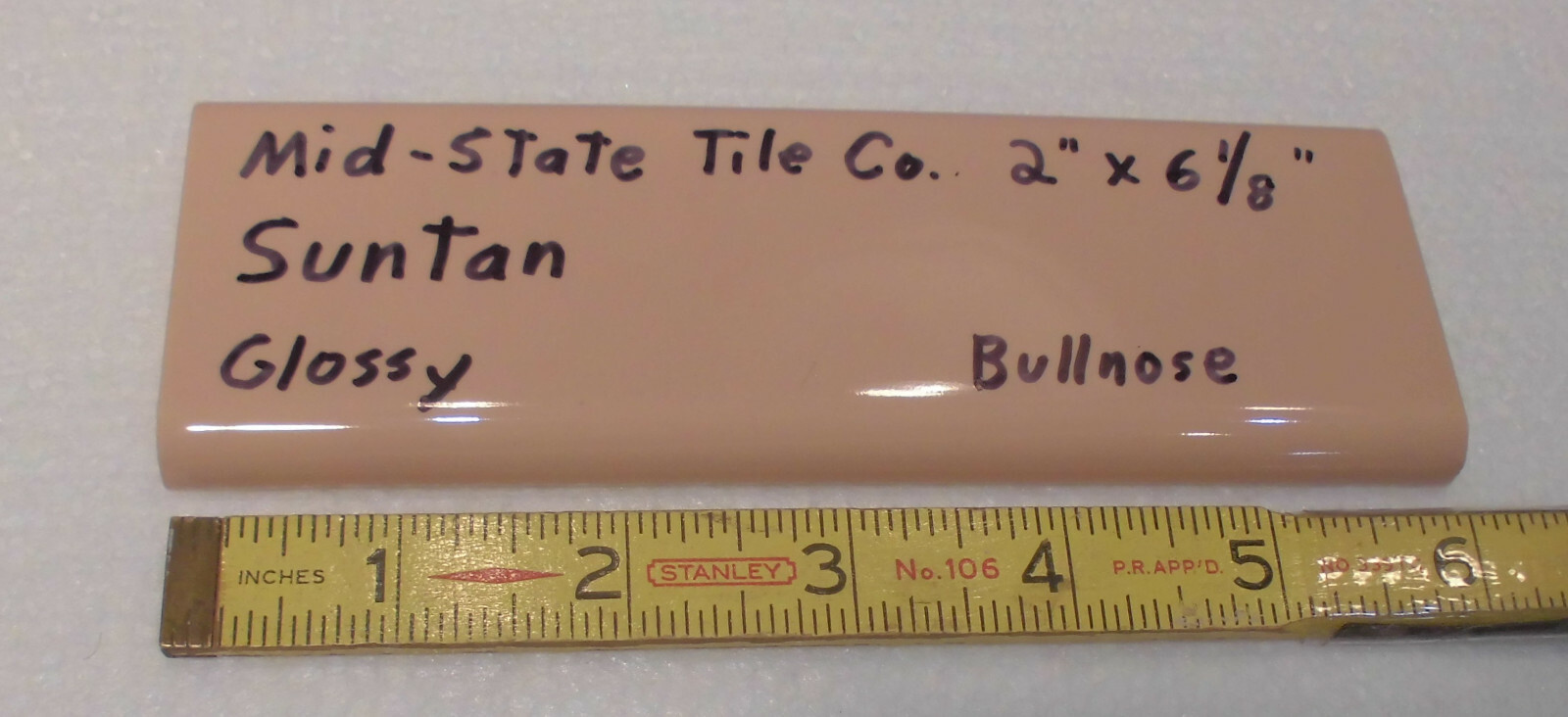1 pc. Suntan-Beige 2” X 6” Glossy Ceramic Surface Bullnose tile by Mid-State Co.