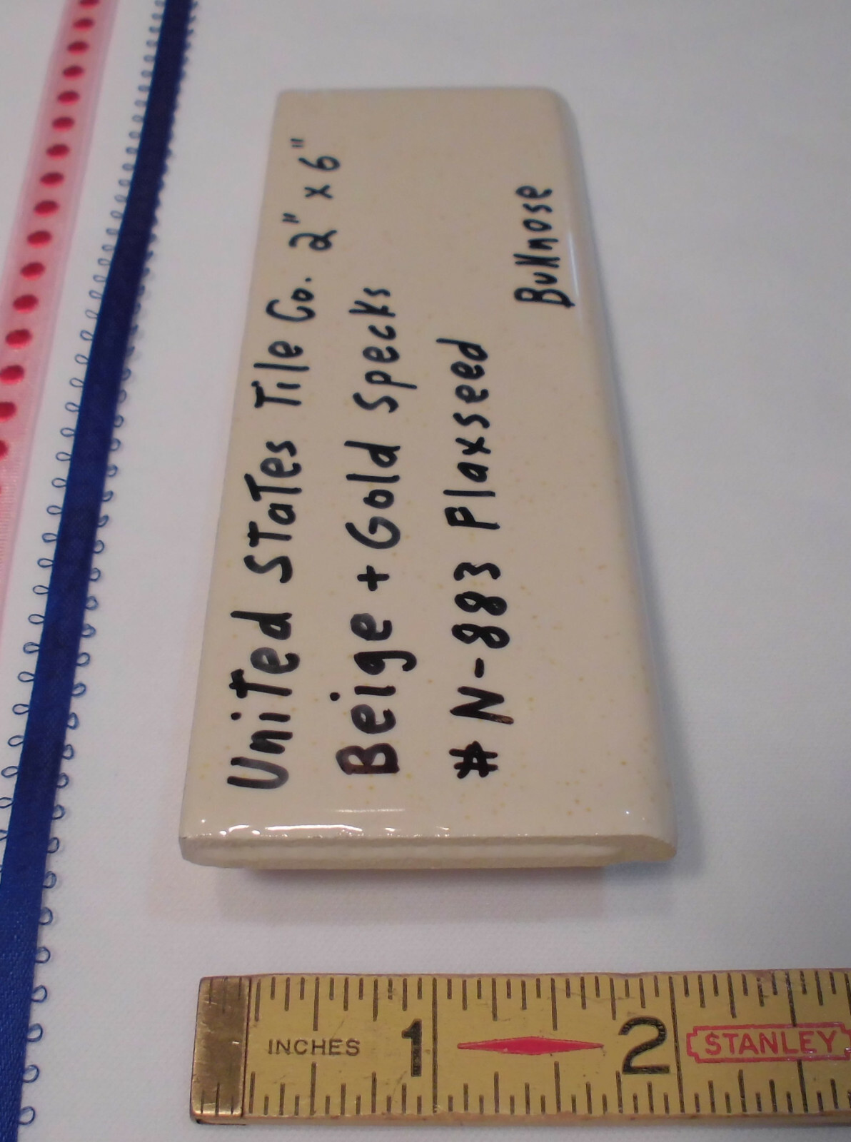1 pc. Flaxseed / Beige + Gold Specks; Glossy Bullnose Surface Flat Ceramic Tile