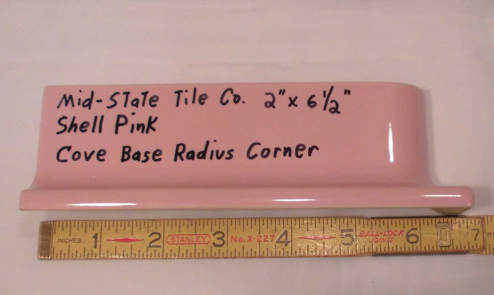 1 pc. Glossy Shell Pink 2” X 6-1/2” Ceramic Radius Cove Base Tile; Flat Top, R