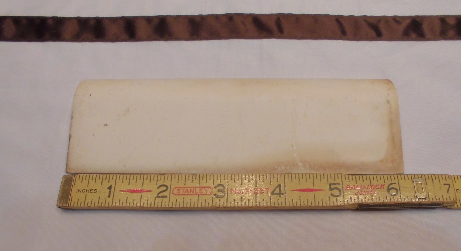 1 pc. Oatmeal – Yellow Speckled; stack-on-top base/cove Ceramic Tile 2″ X 6″