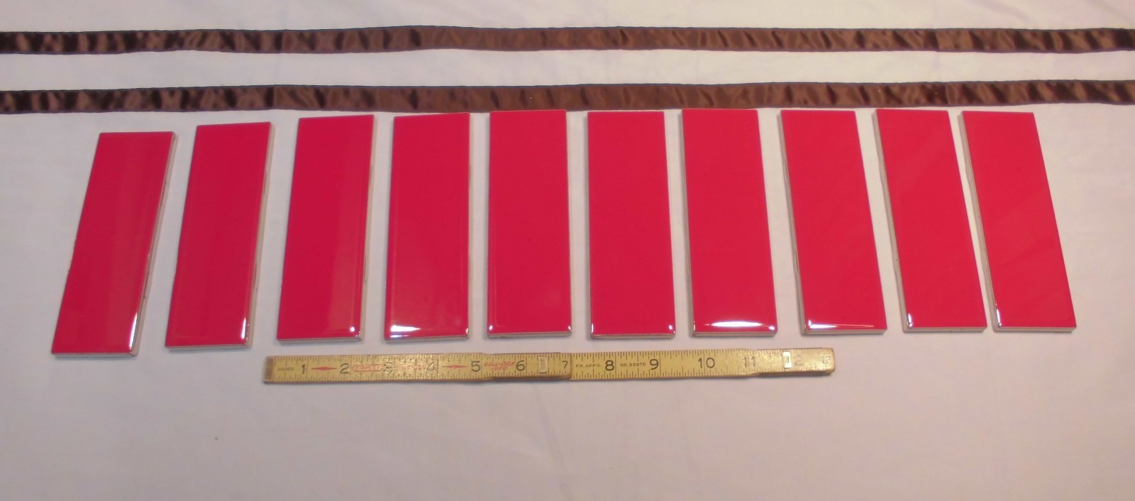 10 pcs. Glossy Ceramic Tiles *Liner/Sizzle *Ruby Red* by American Olean 2″ X 6″