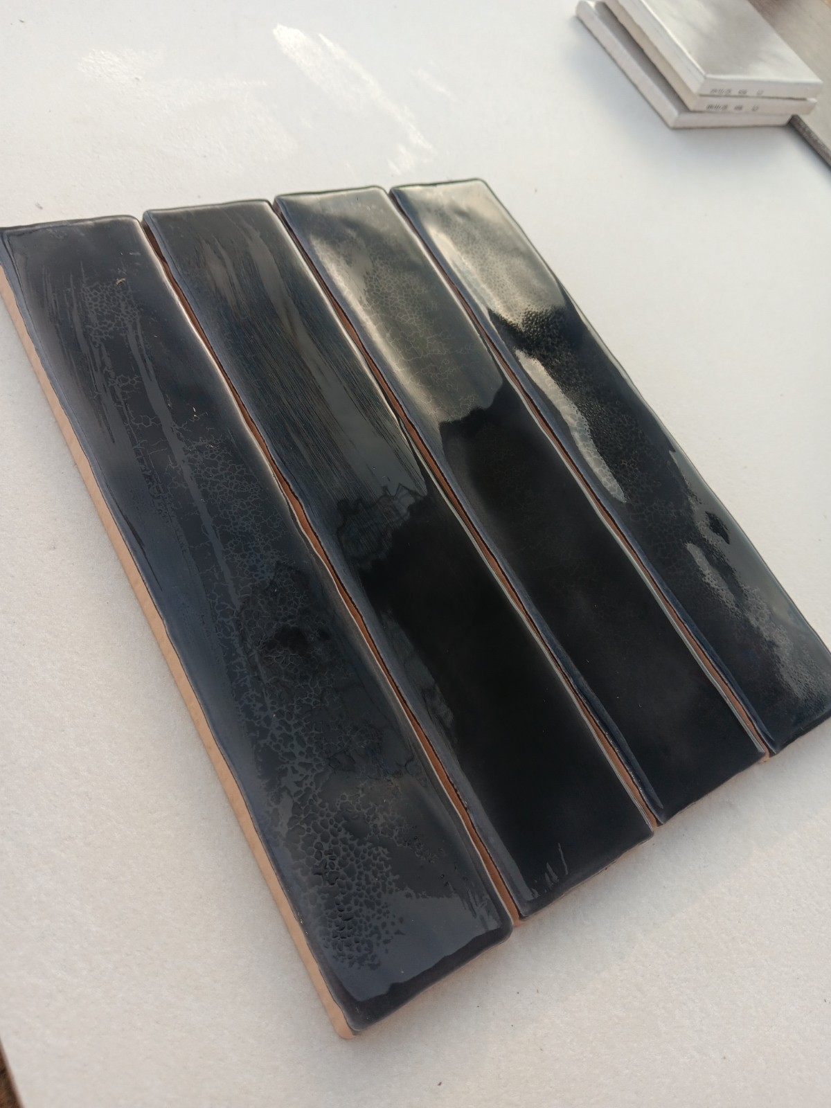 20 Tiles (2.5 ft²) – Glossy Charcoal Black 2″ x 8″ Ceramic Subway Tile