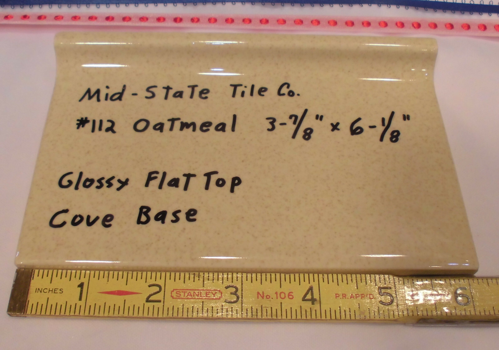 1 pc. Glossy *Oatmeal* 4” X 6” Ceramic Cove Base Tile by Mid-State, flat top