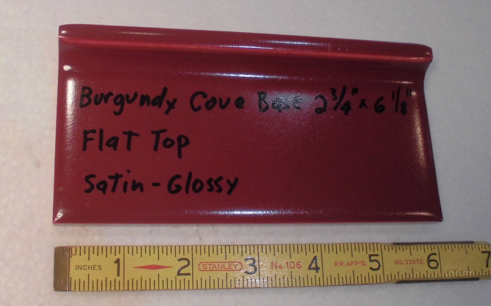 1 pc. Satin Gloss Burgundy: Flat Top base/cove Ceramic Tile: 2-3/4″ X 6-1/8″