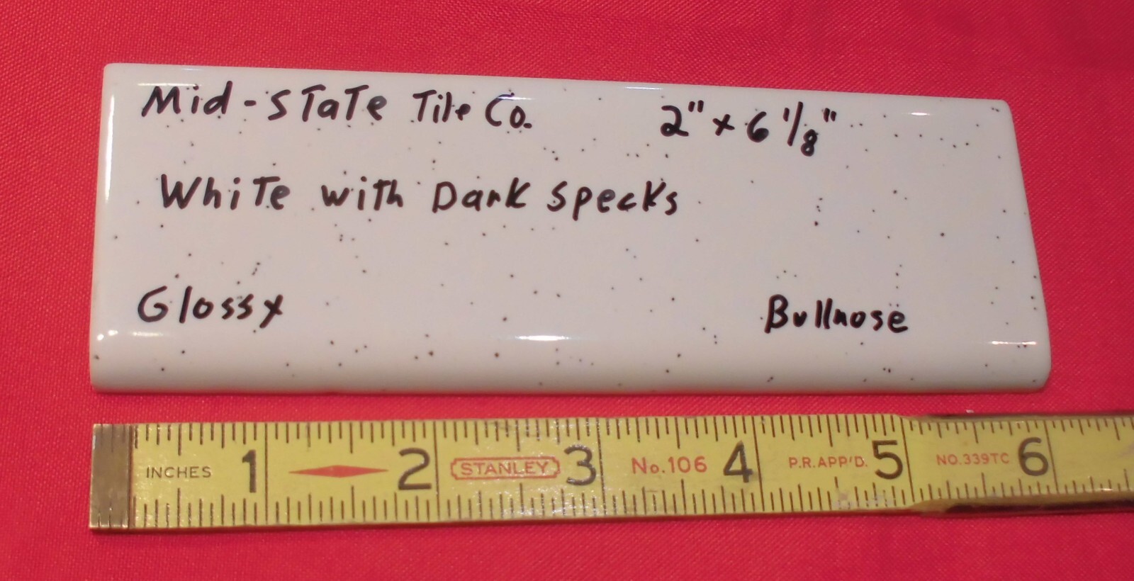 1 pc. White + Dark Specks: 2” X 6” Surface Bullnose Ceramic Tile by MID-STATE